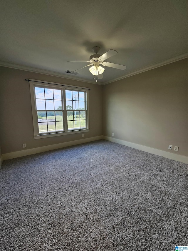 carpeted empty room featuring ornamental molding, visible vents, baseboards, and a ceiling fan