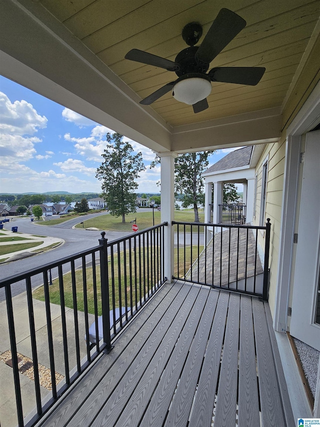 wooden deck featuring ceiling fan