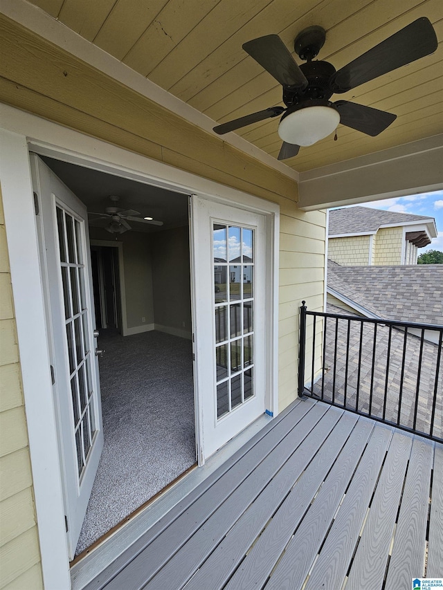 wooden terrace with a ceiling fan