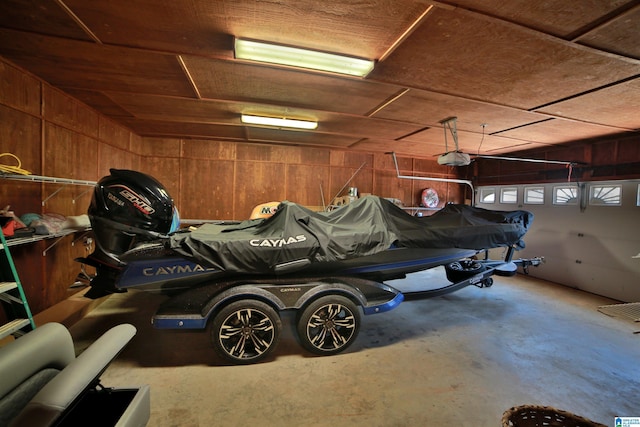 garage featuring wood walls