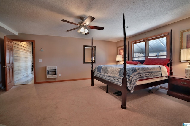 bedroom featuring baseboards, a ceiling fan, light colored carpet, heating unit, and a textured ceiling