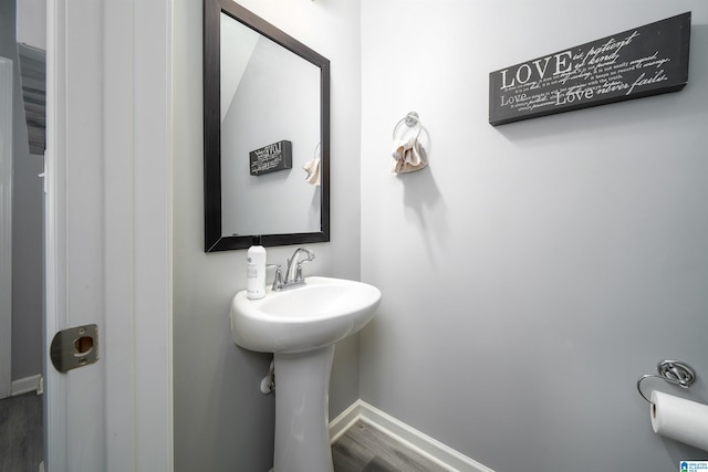 bathroom featuring baseboards and wood finished floors