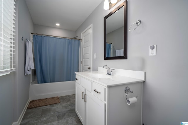 full bath with shower / bath combo, vanity, and baseboards