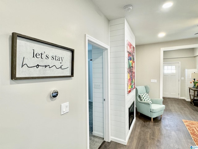 interior space with recessed lighting, dark wood-style flooring, and baseboards