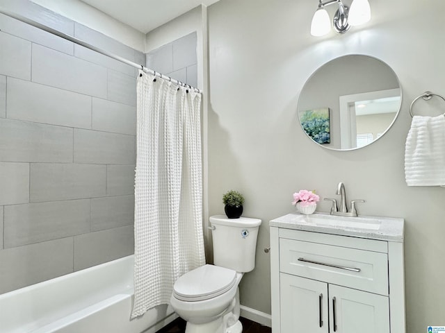 bathroom with toilet, shower / tub combo, baseboards, and vanity