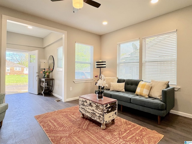 living area with a wealth of natural light, baseboards, and recessed lighting