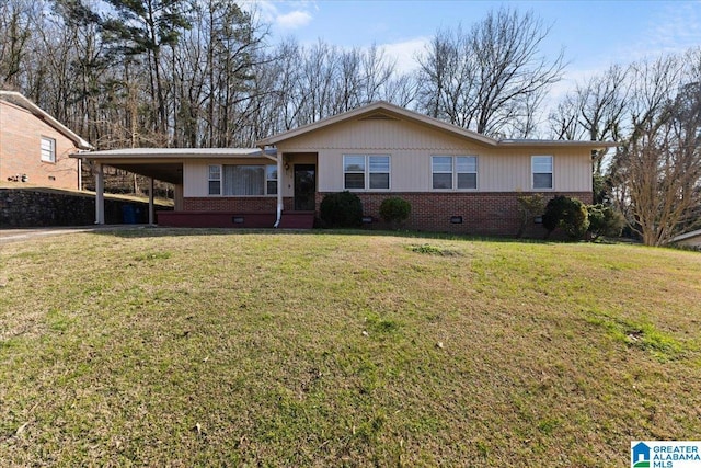 ranch-style house featuring a carport, brick siding, crawl space, and a front yard