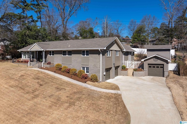 ranch-style house with brick siding, a front yard, fence, a garage, and driveway