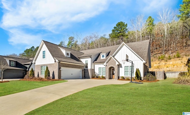 view of front facade with brick siding, board and batten siding, and a front yard