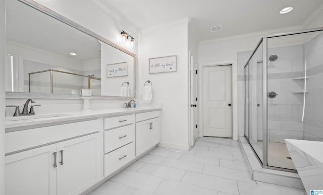 bathroom with crown molding, double vanity, a shower stall, and a sink