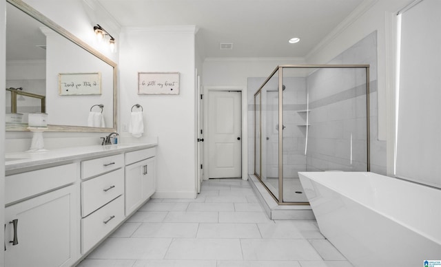 full bathroom featuring a shower stall, a freestanding bath, double vanity, ornamental molding, and a sink