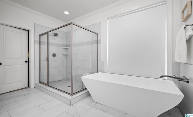 full bath featuring a soaking tub, a shower stall, and crown molding