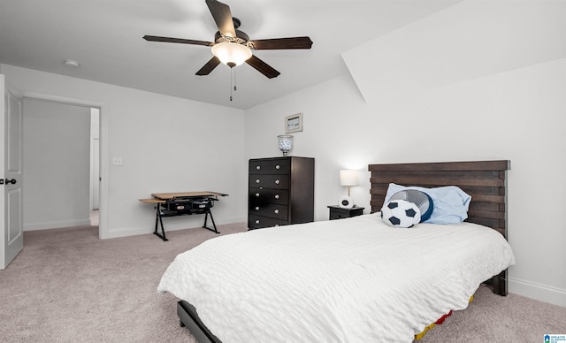 bedroom featuring baseboards, carpet floors, and a ceiling fan