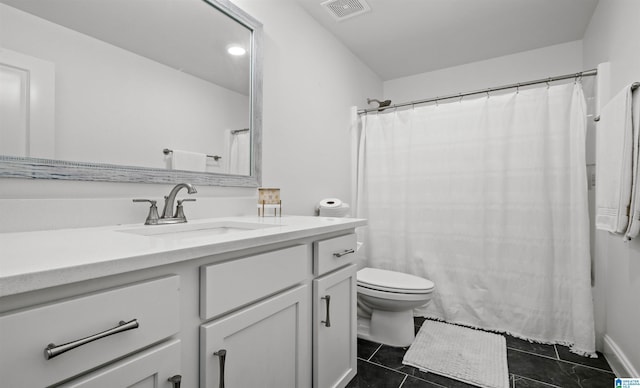 bathroom featuring visible vents, toilet, a shower with curtain, tile patterned floors, and vanity