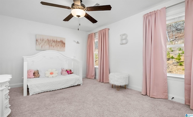 bedroom with carpet flooring, ceiling fan, baseboards, and visible vents