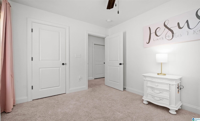 bedroom with carpet flooring, a ceiling fan, and baseboards