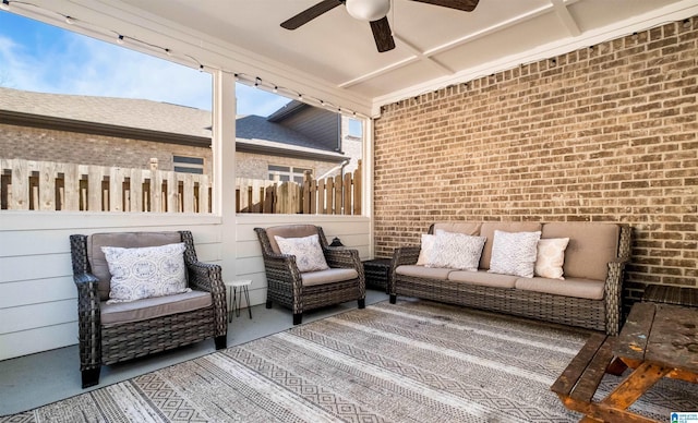 wooden terrace featuring an outdoor hangout area, a ceiling fan, and fence