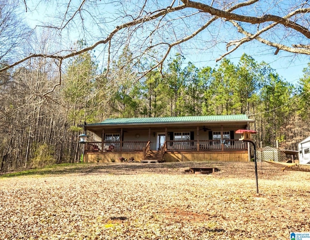 view of front of house with covered porch and metal roof