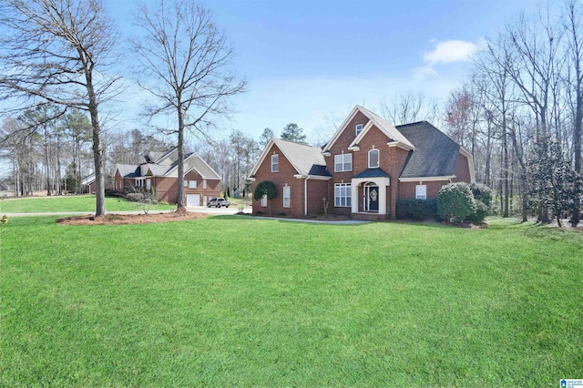 view of front of property with a shingled roof, a front lawn, and brick siding