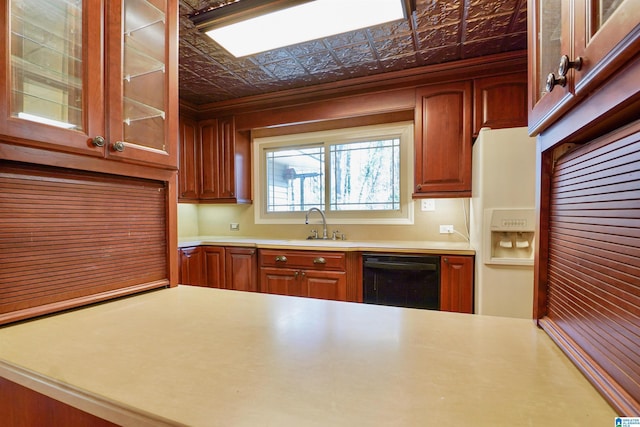 kitchen featuring black dishwasher, an ornate ceiling, light countertops, and a sink