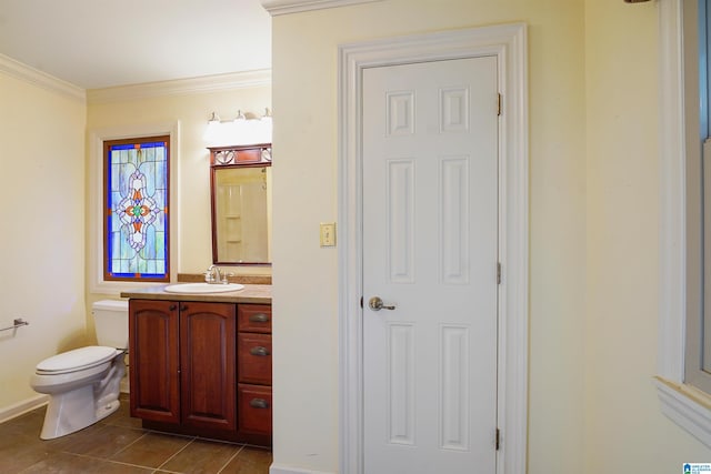 bathroom featuring ornamental molding, vanity, toilet, and tile patterned floors