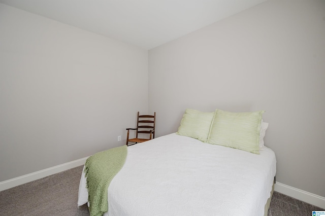 carpeted bedroom with baseboards