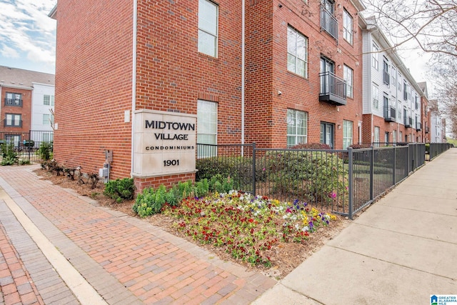 view of building exterior featuring fence