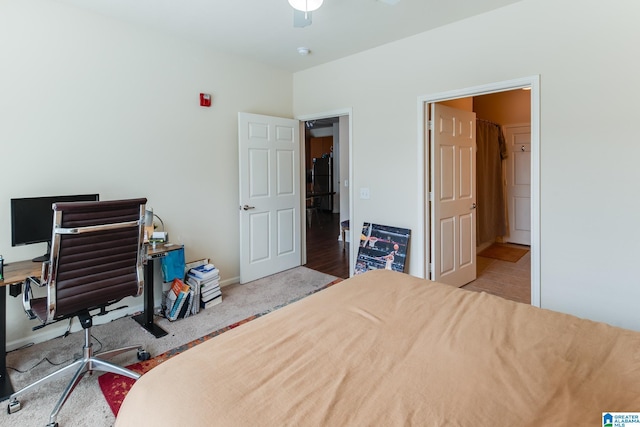 bedroom with ceiling fan, carpet, and baseboards