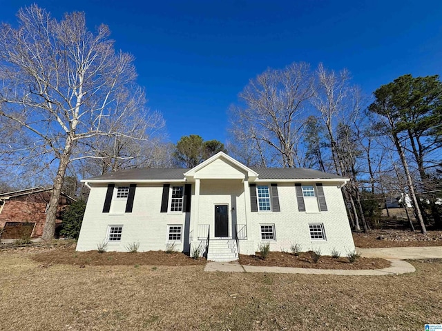 bi-level home with brick siding