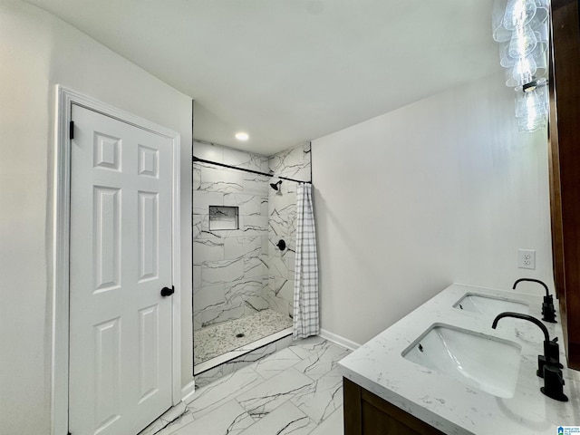 full bathroom with marble finish floor, a sink, and a marble finish shower