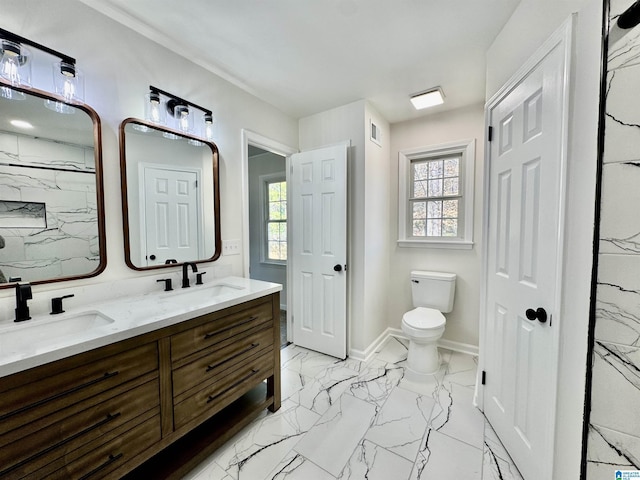 bathroom featuring visible vents, marble finish floor, a sink, and toilet