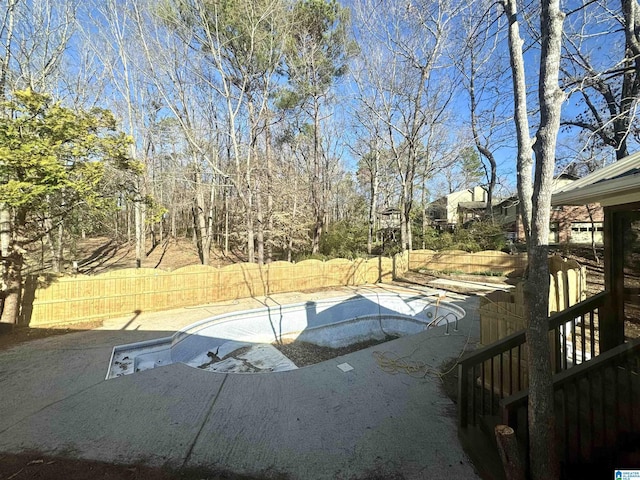 view of swimming pool with a fenced in pool, a fenced backyard, and a patio