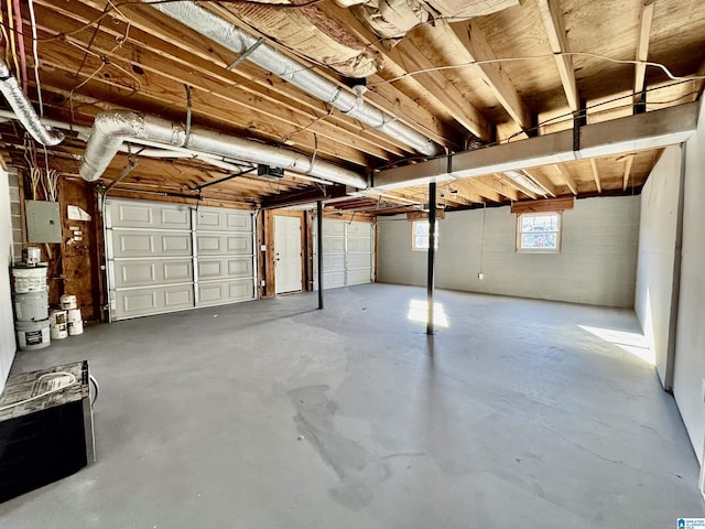 garage featuring a garage door opener and electric panel