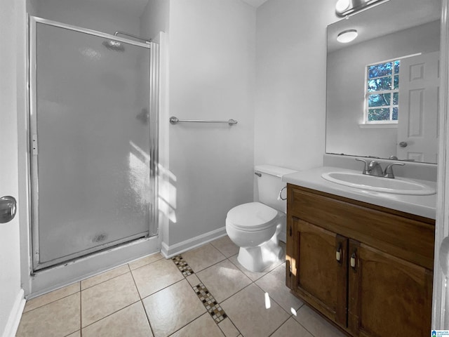 full bathroom featuring tile patterned flooring, toilet, vanity, baseboards, and a stall shower