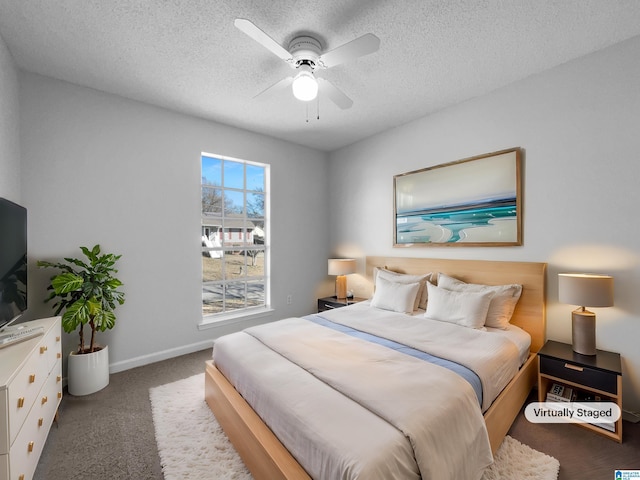 bedroom with a textured ceiling, carpet, a ceiling fan, and baseboards