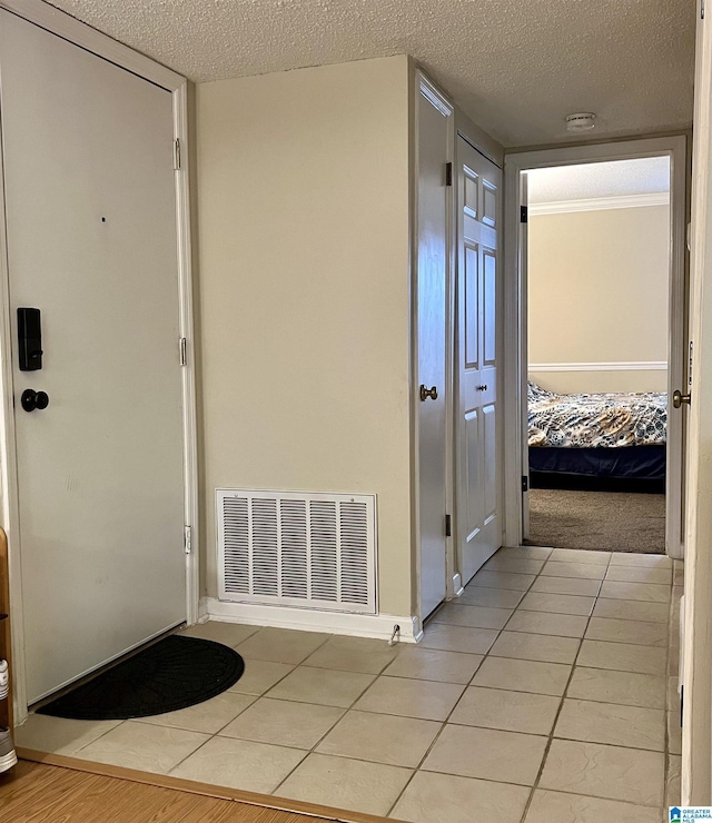 171 Old Montgomery Hwy Unit A, Homewood, AL 35216 - hall with a textured ceiling, light tile patterned floors, and baseboards