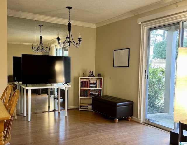 171 Old Montgomery Hwy Unit A, Homewood, AL 35216 - living room with a chandelier, wood finished floors, a textured ceiling, ornamental molding, and baseboards