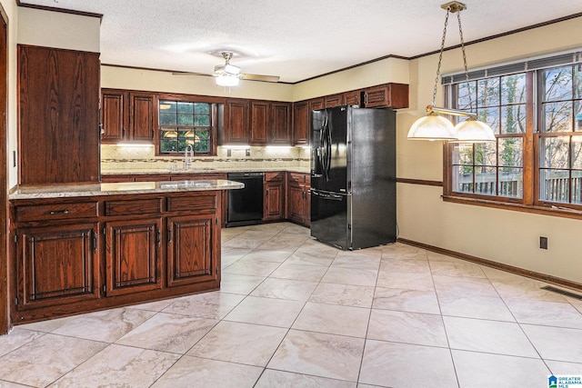 kitchen featuring crown molding, tasteful backsplash, visible vents, a sink, and black appliances