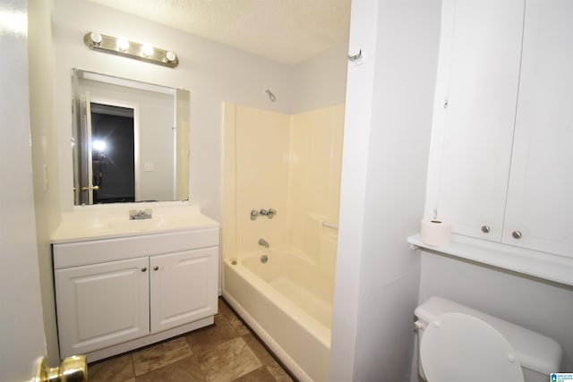 full bathroom with toilet, tub / shower combination, a textured ceiling, and vanity