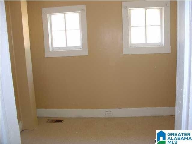 interior space featuring visible vents and baseboards