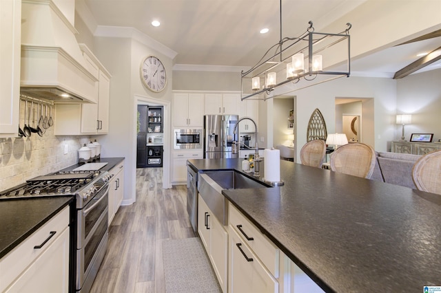 kitchen with crown molding, stainless steel appliances, decorative backsplash, wood finished floors, and premium range hood