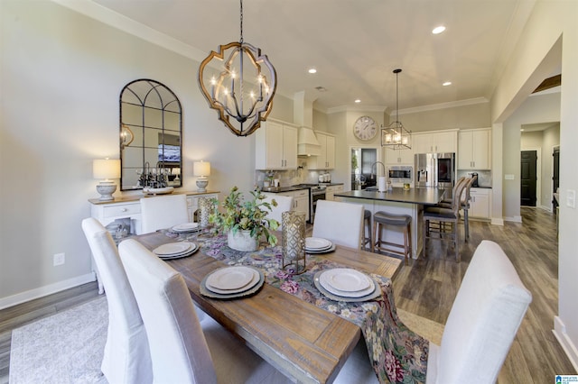 dining area featuring ornamental molding, dark wood-type flooring, and a notable chandelier