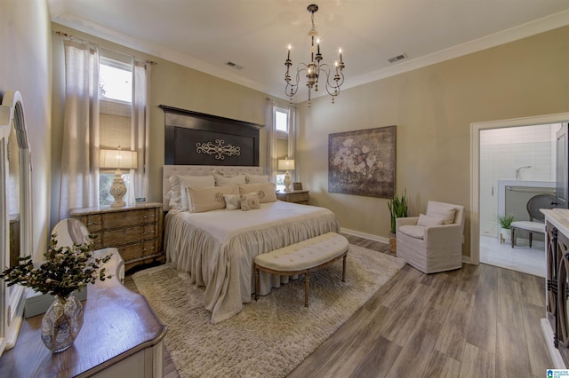 bedroom featuring ornamental molding, visible vents, baseboards, and wood finished floors