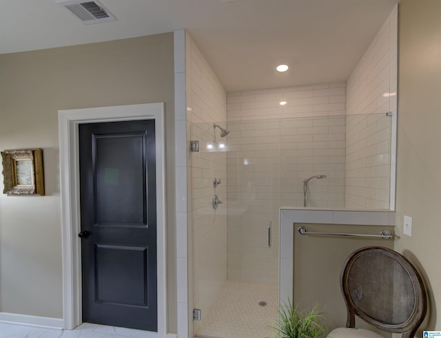 bathroom featuring a stall shower, visible vents, and recessed lighting