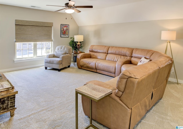 living area featuring lofted ceiling, ceiling fan, light colored carpet, visible vents, and baseboards