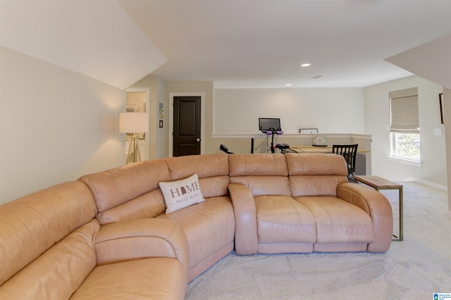 carpeted living area with recessed lighting