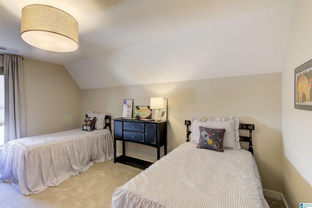 carpeted bedroom featuring baseboards, visible vents, and vaulted ceiling