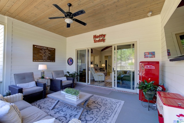 view of patio with an outdoor living space and a ceiling fan