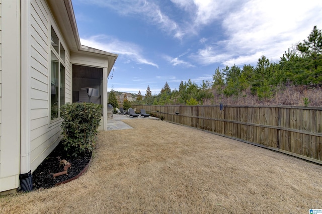 view of yard featuring a patio area and fence