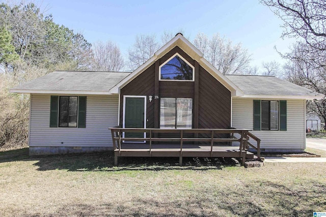 view of front facade with crawl space, a deck, and a front lawn